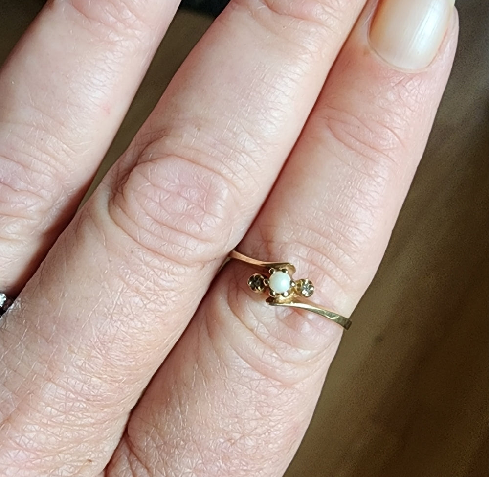 You're getting a pearl and diamond ring size 6.5 10K Plumb gold