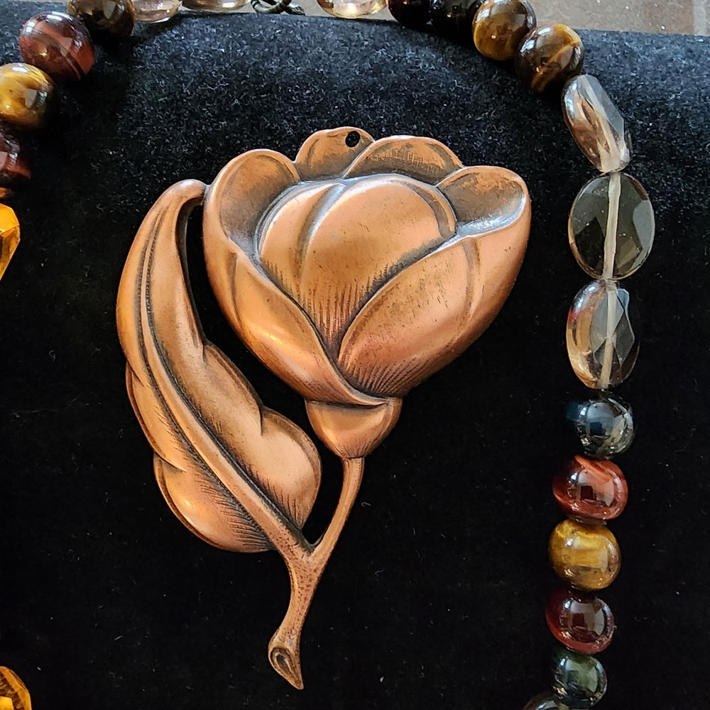 Two piece jewelry lot glass and tiger's eye necklace big copper flower pendant