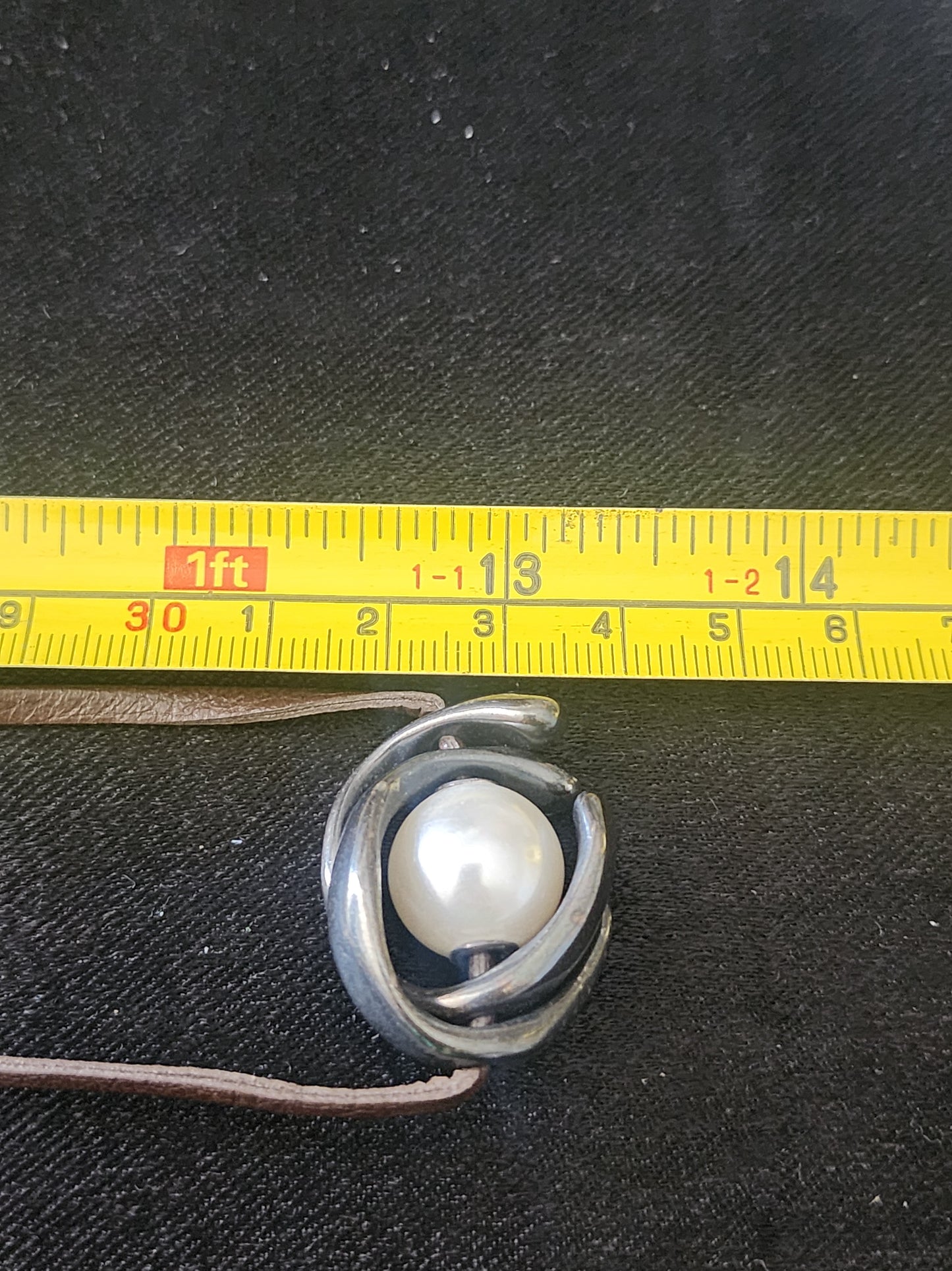 Uno de 50 mid century style pendant on leather cord is faux pearl unisex