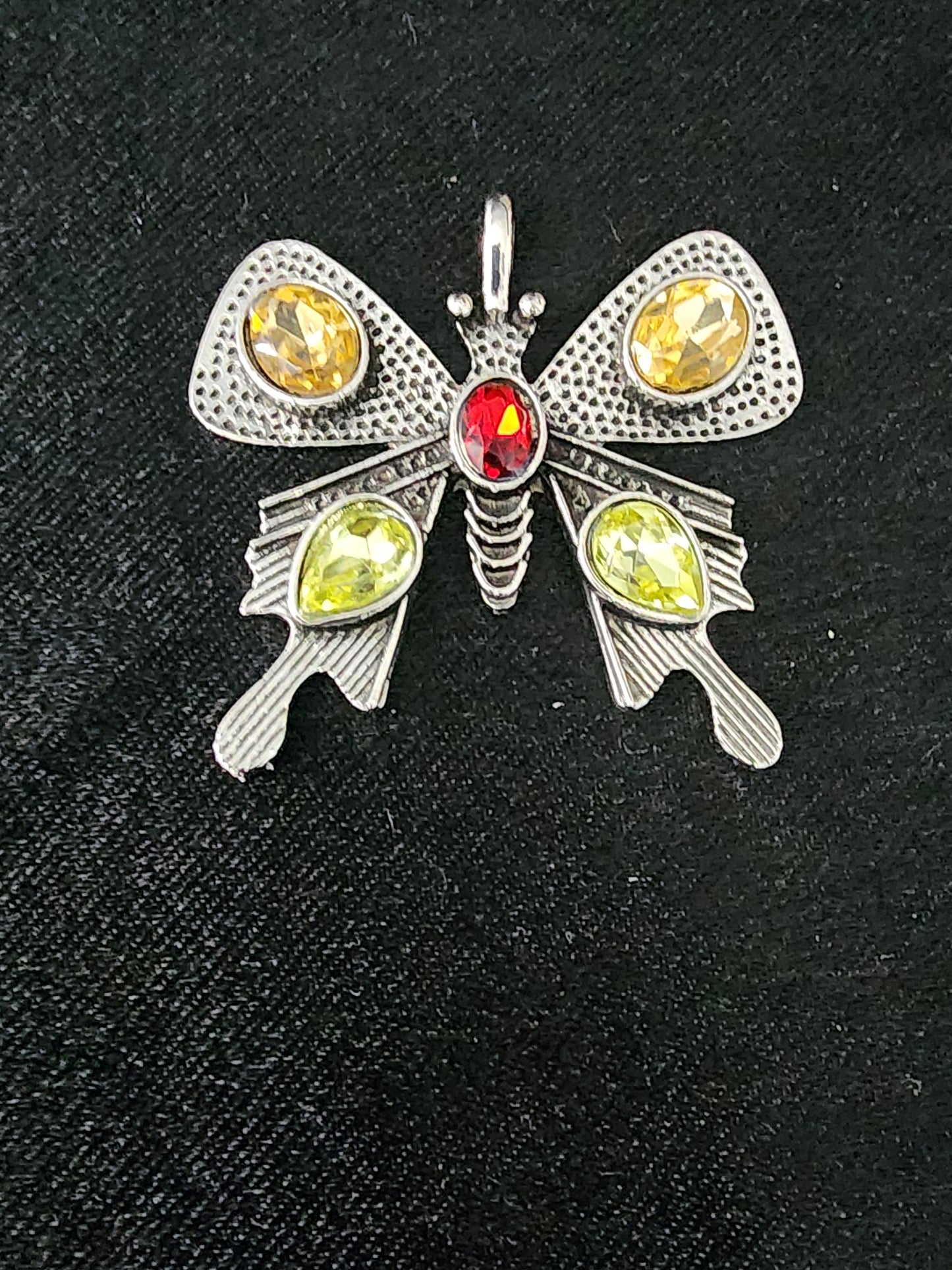 Butterfly pendant with green yellow gemstones