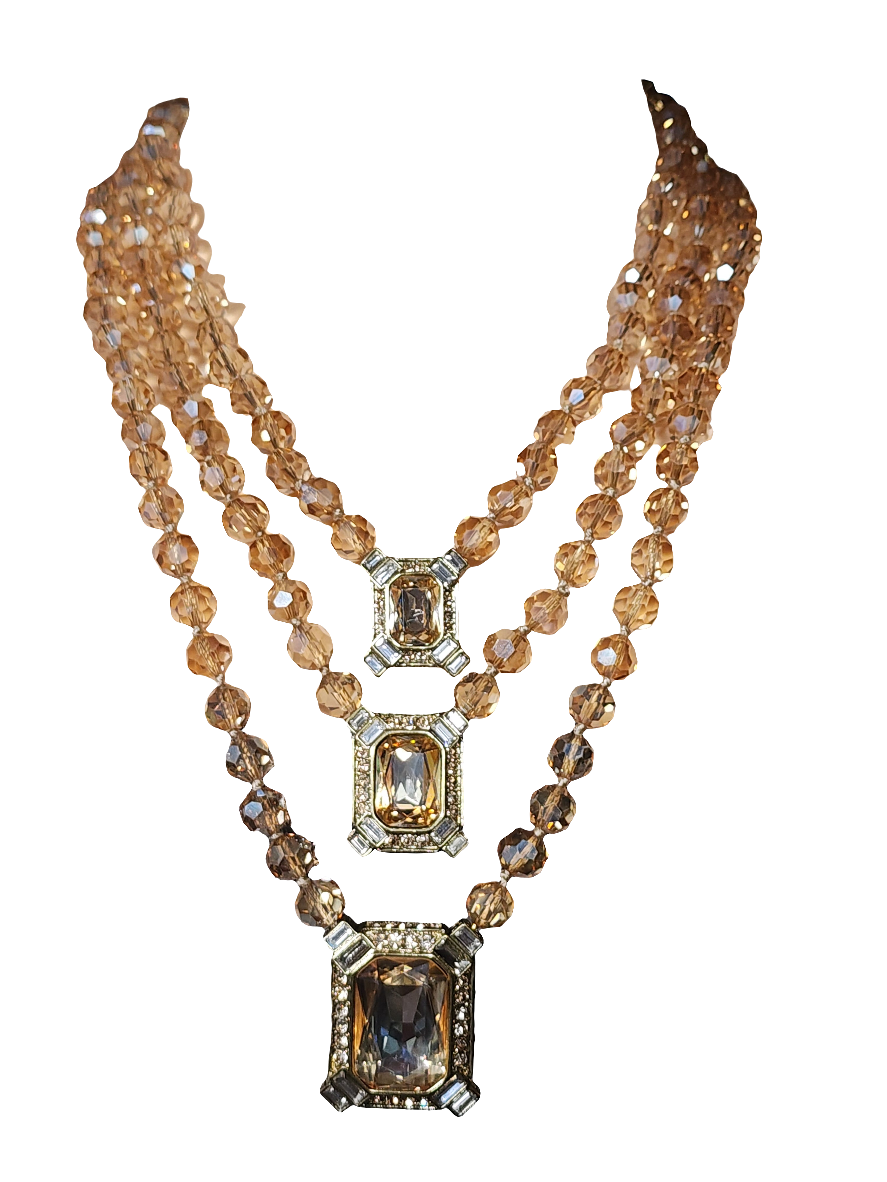 Heidi Daus golden crystals three strand necklace and clip on earrings set