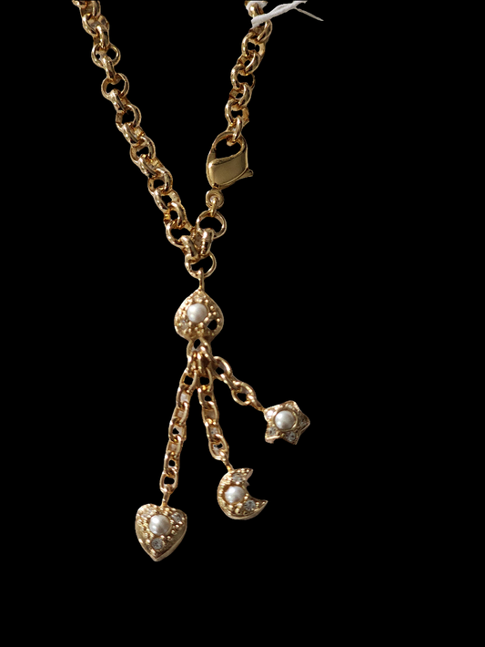 Christian Dior gold tone bracelet with dangling charms heart star moon