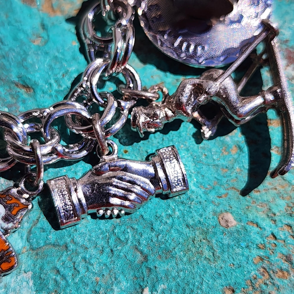 Monet bracelet with sterling silver charms Mickey Mouse guitar Stein Odd Fellows