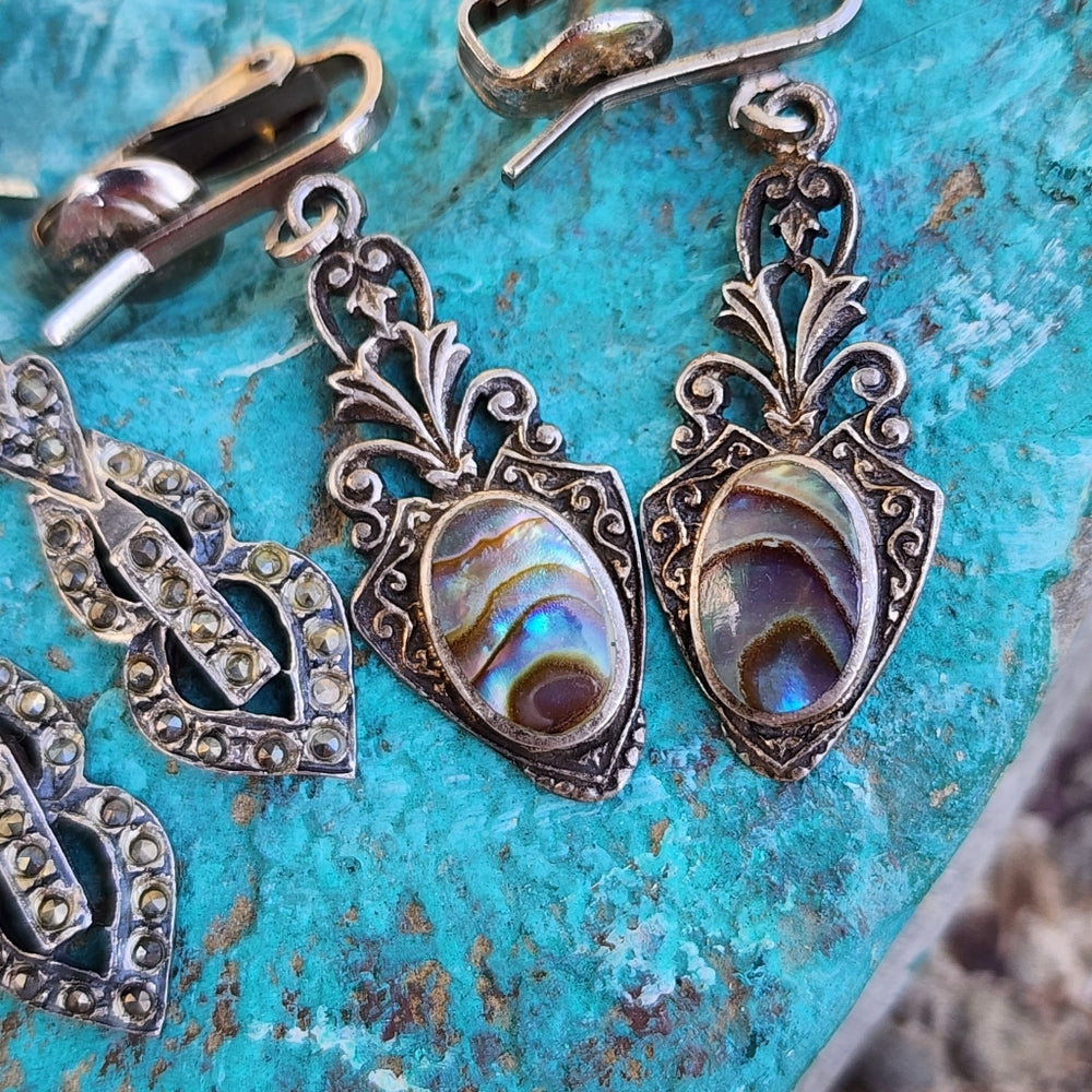 Three pairs of clip-on sterling silver earrings