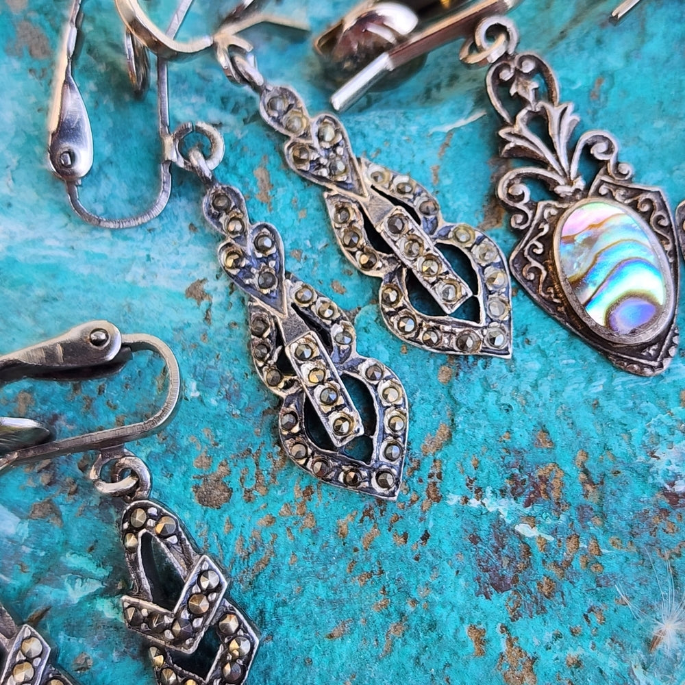 Three pairs of clip-on sterling silver earrings