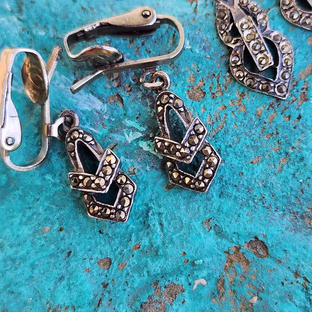 Three pairs of clip-on sterling silver earrings