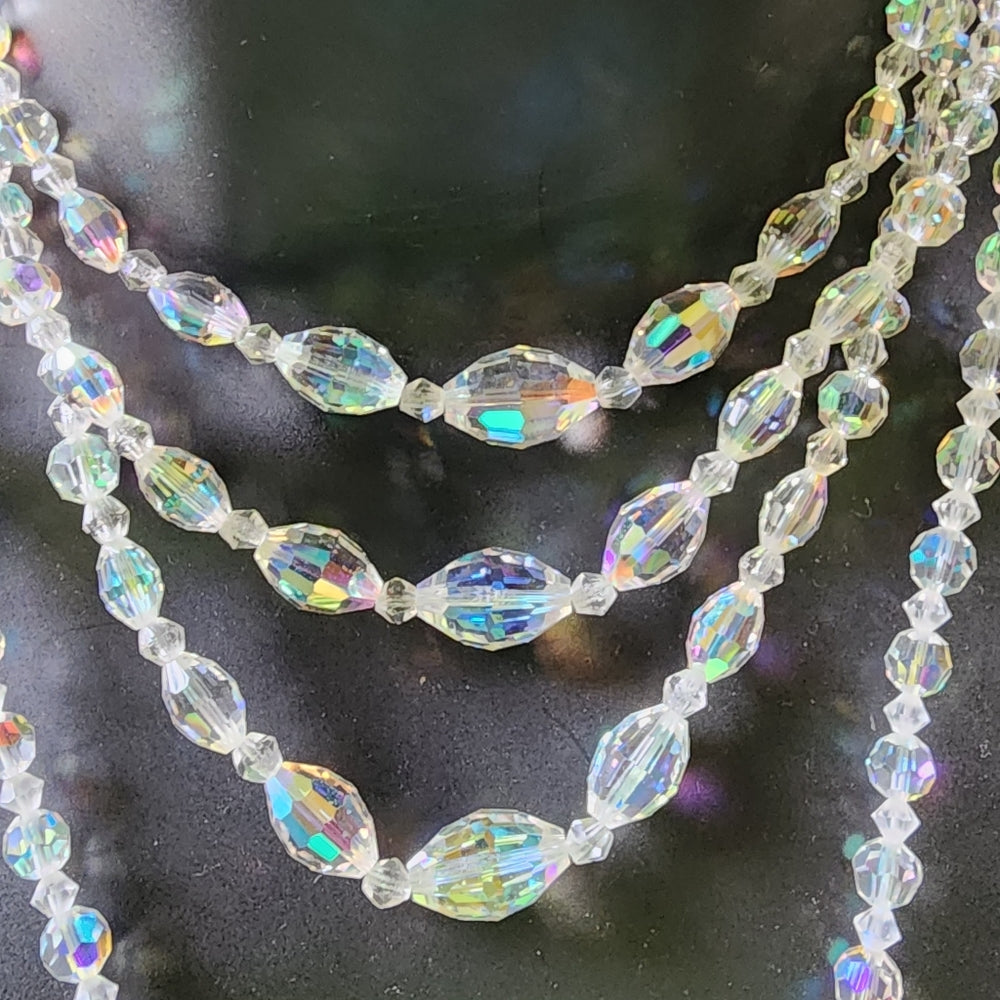 Lot of two Aurora Borealis glass bead necklaces three strand & 1 strand