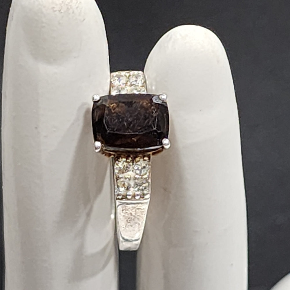 Sterling silver ring with Brown and clear stones size 7 maker is STS