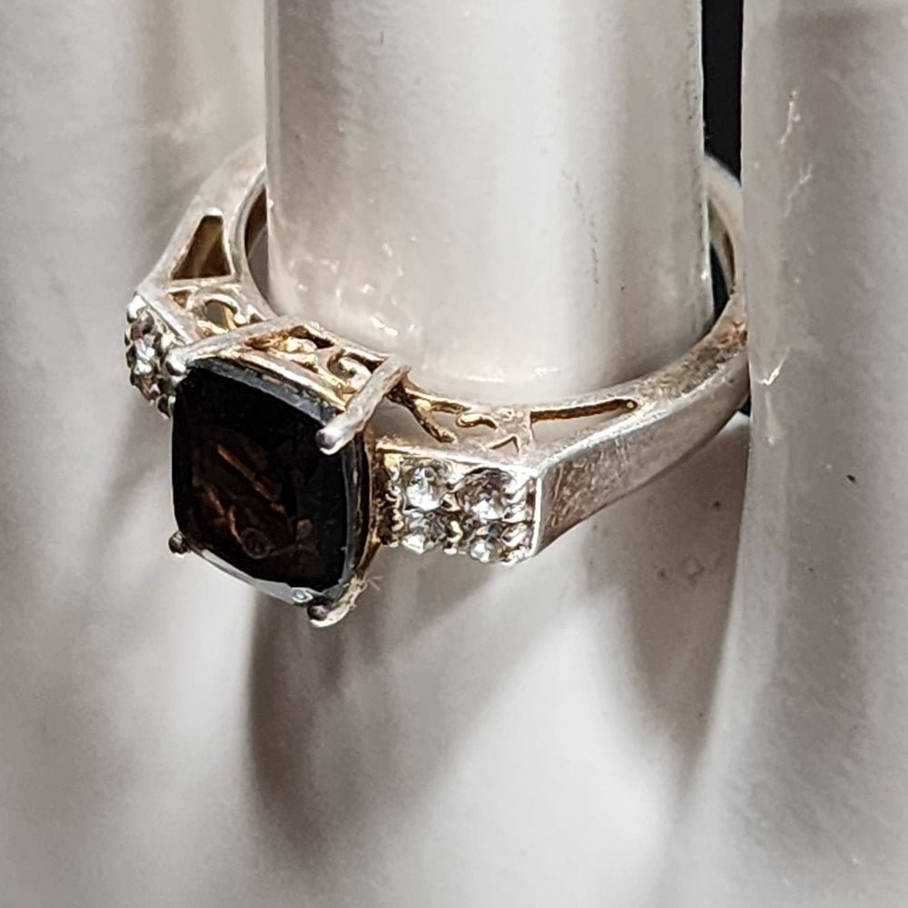 Sterling silver ring with Brown and clear stones size 7 maker is STS