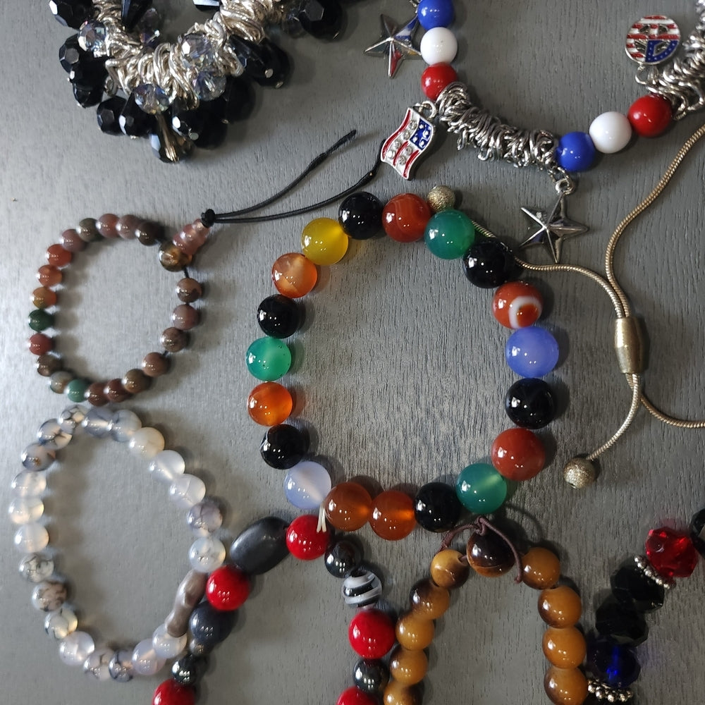Costume fashion jewelry lot of bracelets mostly stretch some charms
