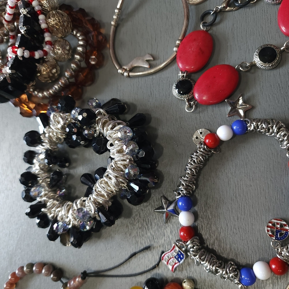 Costume fashion jewelry lot of bracelets mostly stretch some charms