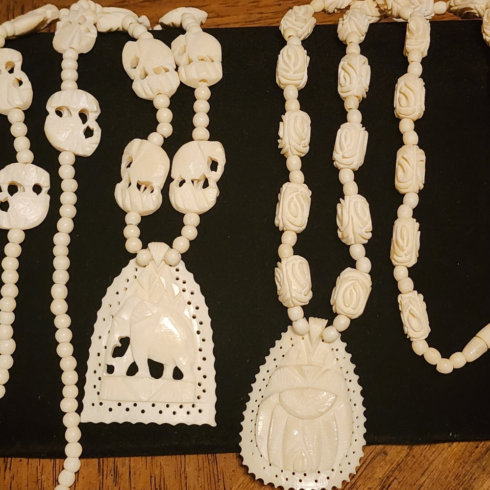 Organic costume jewelry lot 2 carved necklaces elephant and scarab bone ?