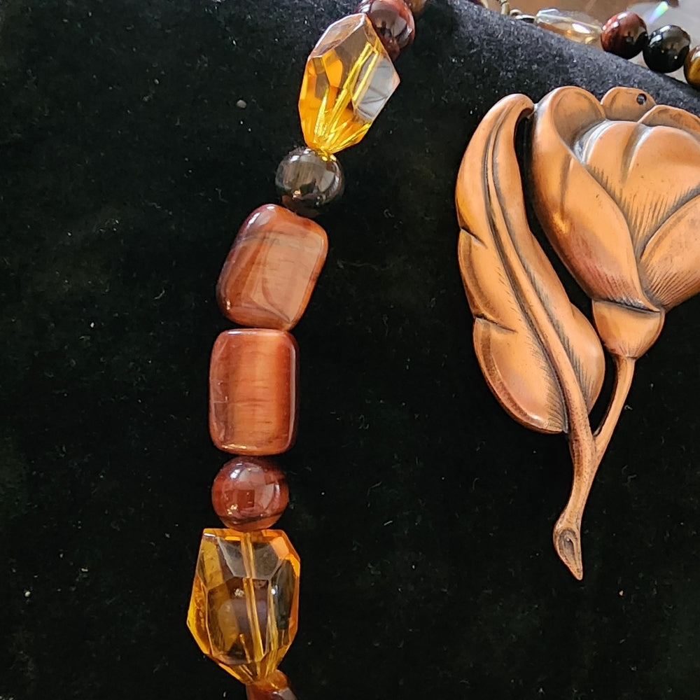 Two piece jewelry lot glass and tiger's eye necklace big copper flower pendant