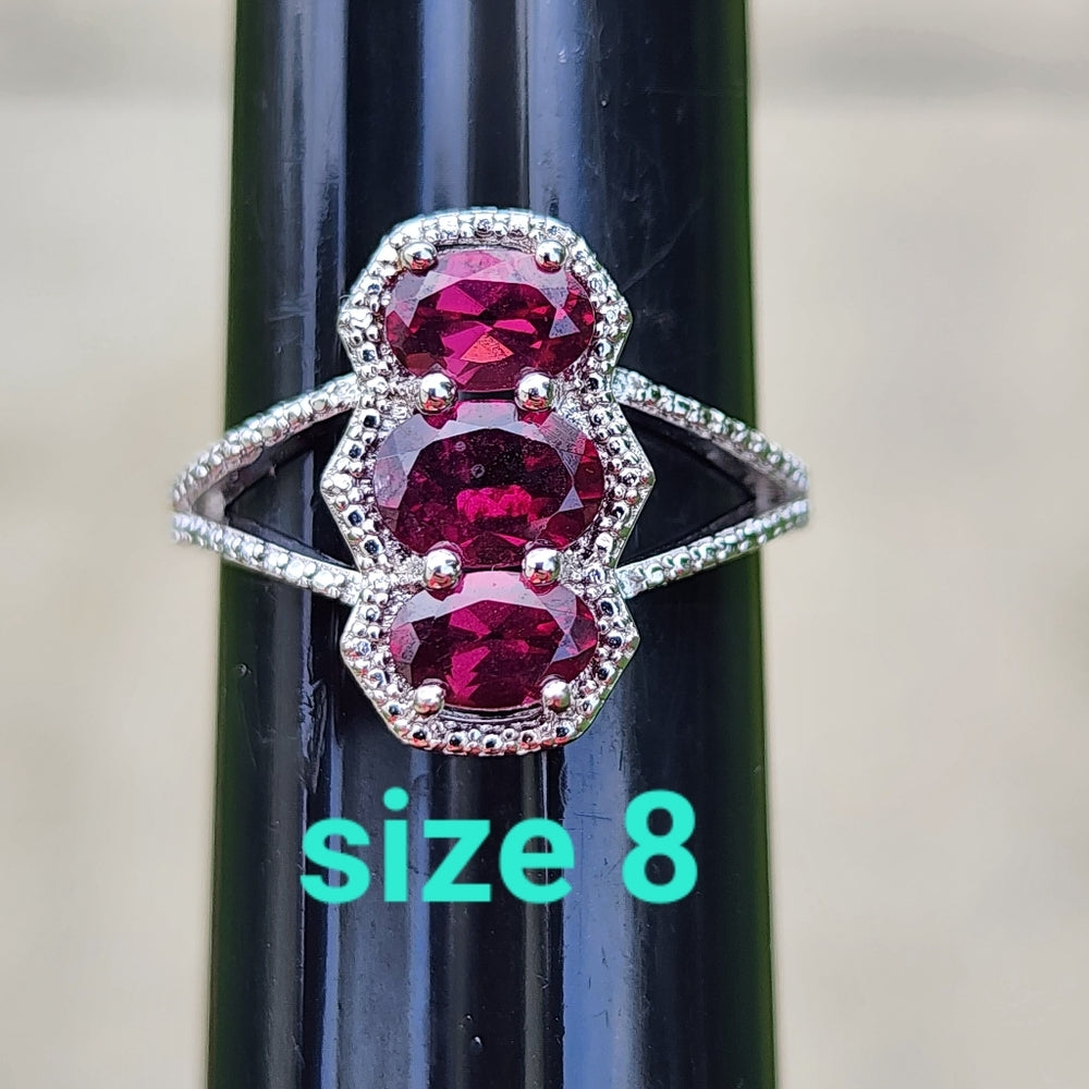 Sterling silver ring with purplish pink Stones size 8 fine jewelry