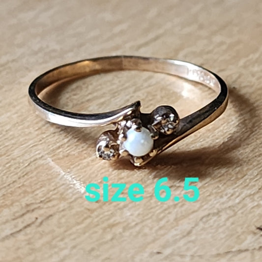 You're getting a pearl and diamond ring size 6.5 10K Plumb gold