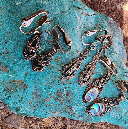 Three pairs of clip-on sterling silver earrings