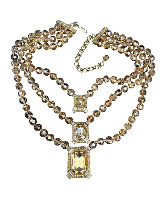 Heidi Daus golden crystals three strand necklace and clip on earrings set