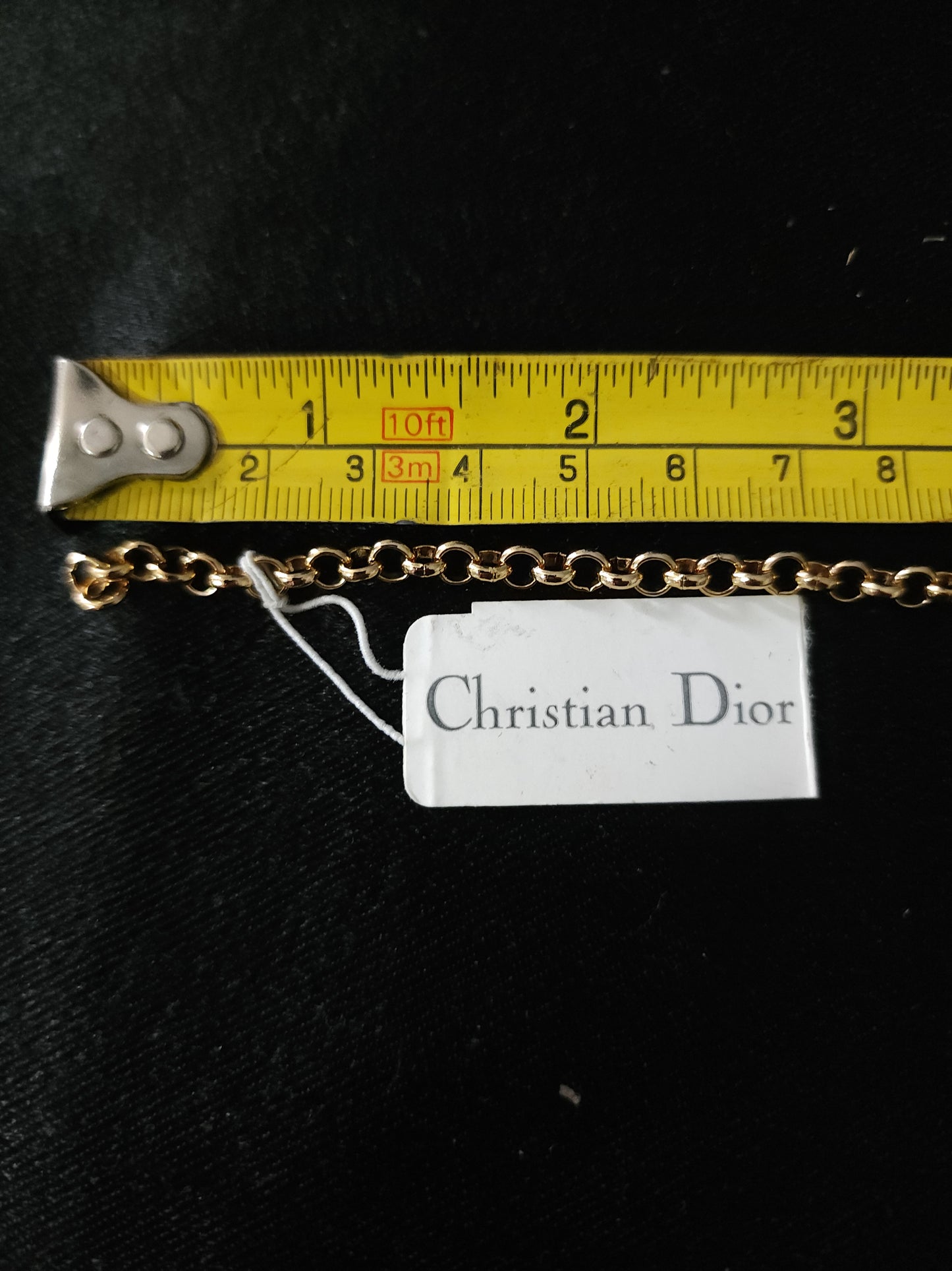 Christian Dior gold tone bracelet with dangling charms heart star moon