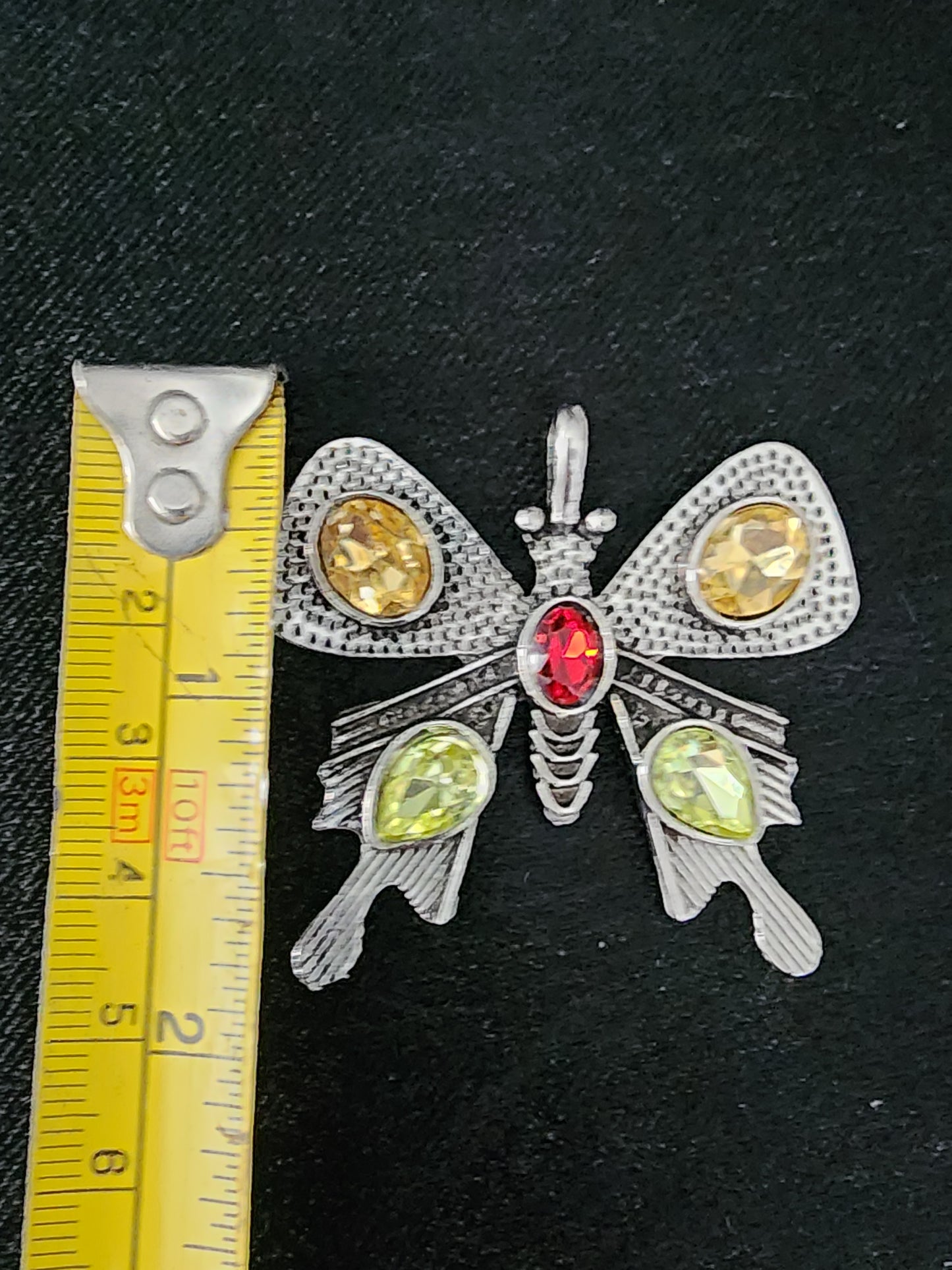 Butterfly pendant with green yellow gemstones