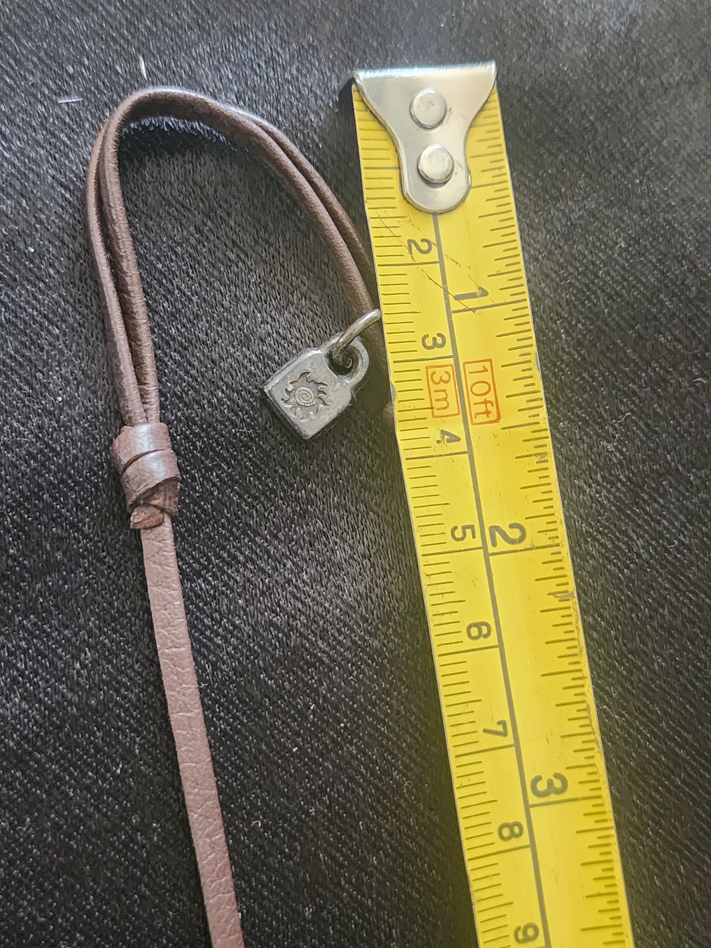 Uno de 50 mid century style pendant on leather cord is faux pearl unisex