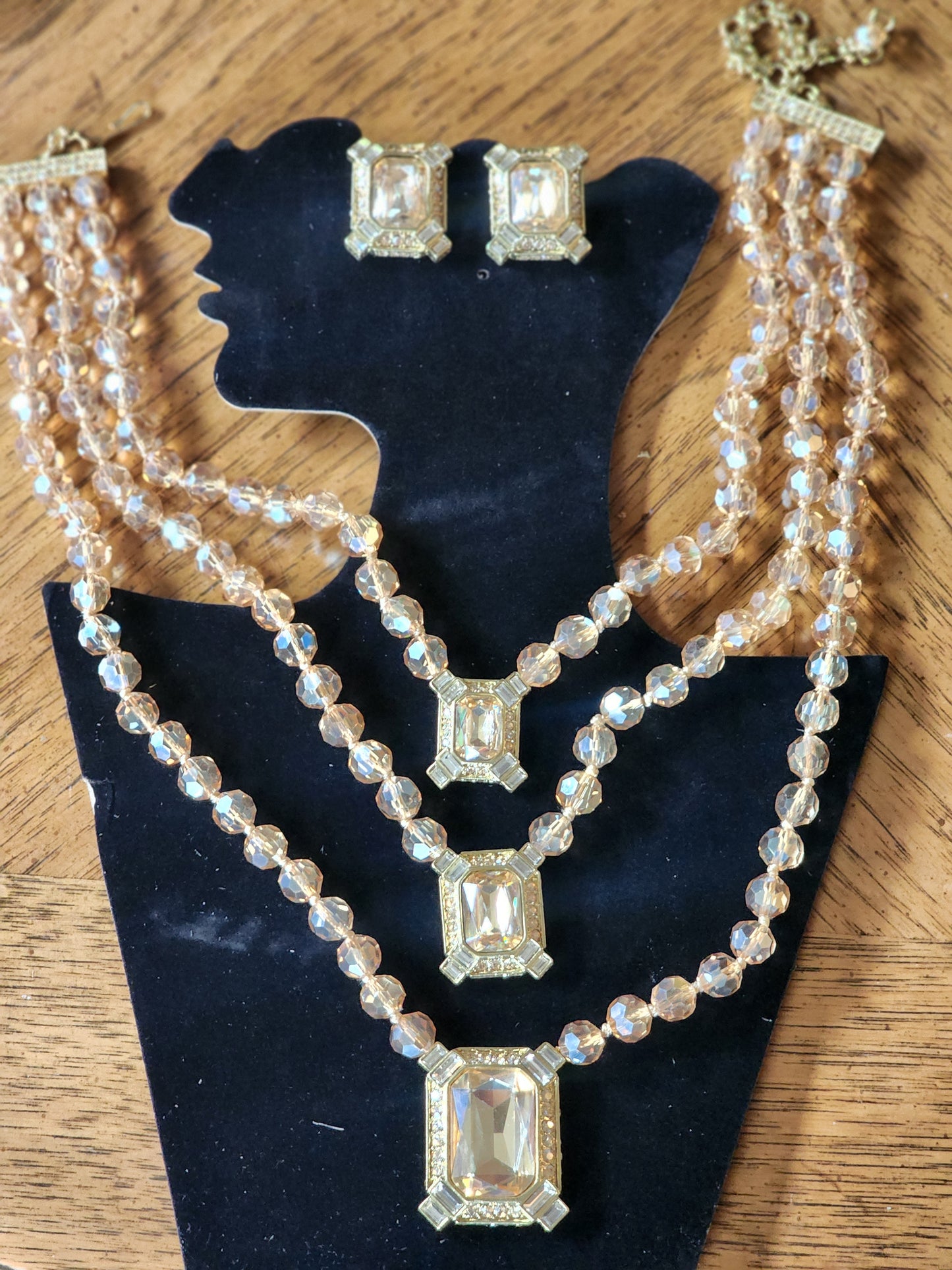 Heidi Daus golden crystals three strand necklace and clip on earrings set